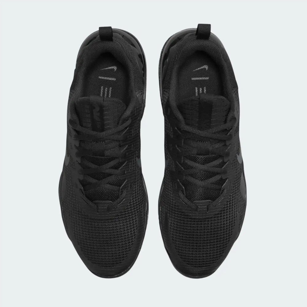 Top-Down view of a pair of Nike Air Max Alpha Trainer 5 Men's shoes in black, highlighting their sturdy silhouette and lace-up closure.