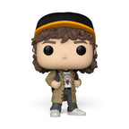 Displays the standalone vinyl figure of Dustin Henderson in a confident stance, featuring his curly brown hair, black and yellow trucker cap, tan coat, white Hellfire Club logo shirt, blue backpack straps, dark grey trousers, and white trainers.