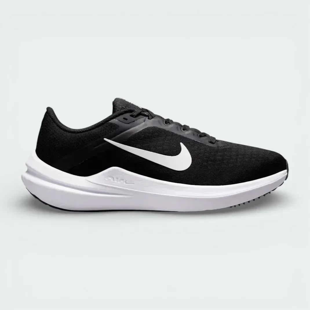 Nike Air Winflo 10 Women's trainers in black, side profile showing the white Nike Swoosh, engineered mesh upper, and the thick cushioned midsole. Main image