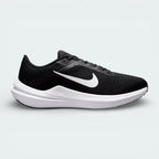 Nike Air Winflo 10 Women's trainers in black, side profile showing the white Nike Swoosh, engineered mesh upper, and the thick cushioned midsole.