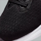Close-up of the front of the Nike Winflo 10, showing the detail of the engineered mesh and the sturdy lacing system for midfoot support.