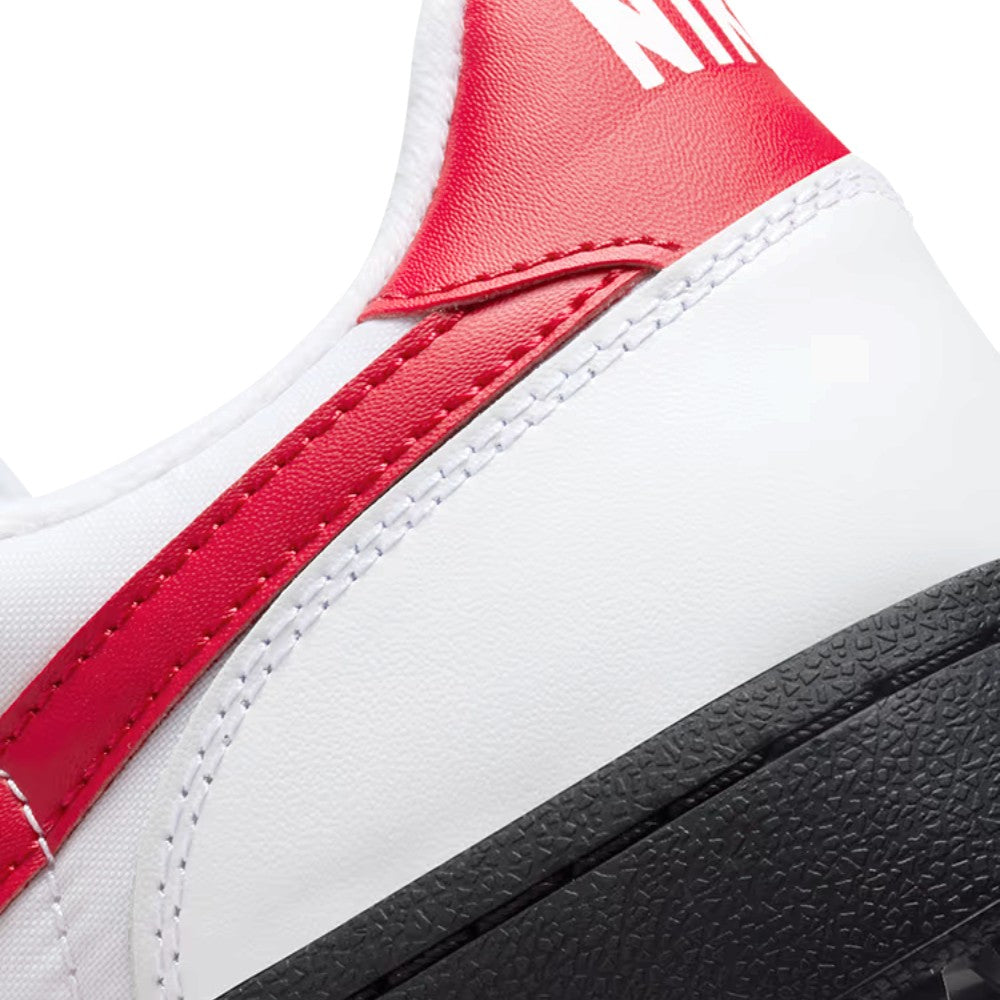 Close-up of the rear heel collar stitching and the textured grain of the red leather heel tab.