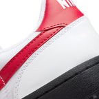 Close-up of the rear heel collar stitching and the textured grain of the red leather heel tab.
