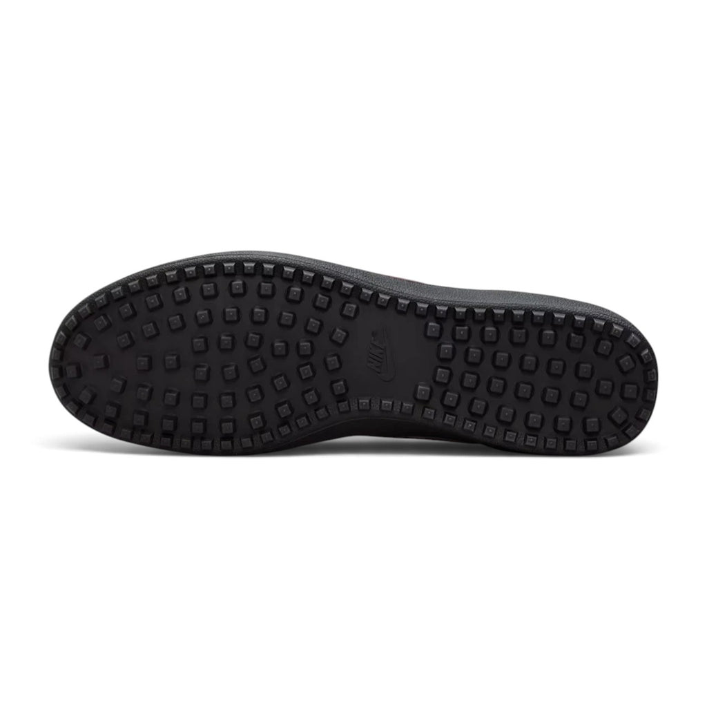 Bottom sole view of the sneaker displaying the black rubber Waffle traction pattern with embedded Nike branding.