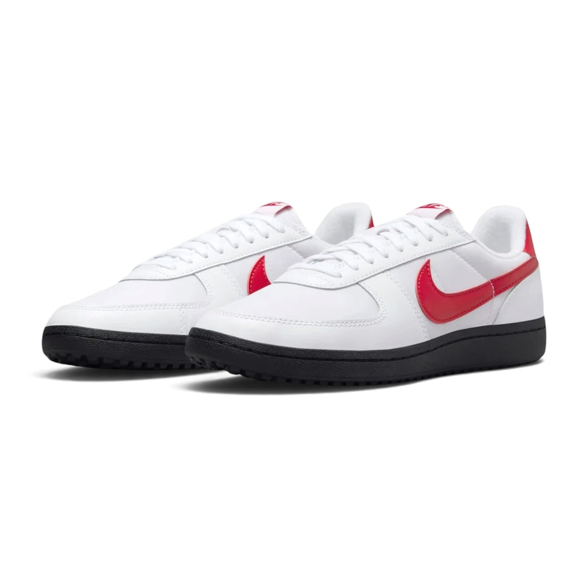Forward three-quarter angle showcasing both sneakers side by side, highlighting their low-profile turf-inspired stance and clean white-and-red colour blocking.