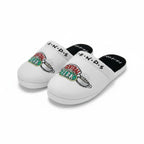 White slippers with 'Central Perk' and friends logos on a white background