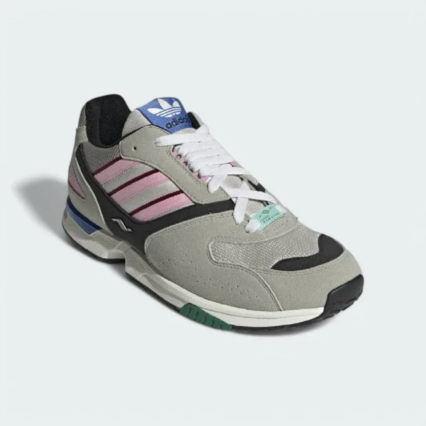 Close-up zoom on the front of the Adidas ZX 4000 Men's grey trainers, showing the mesh toe box, lacing system, and textured overlays.
