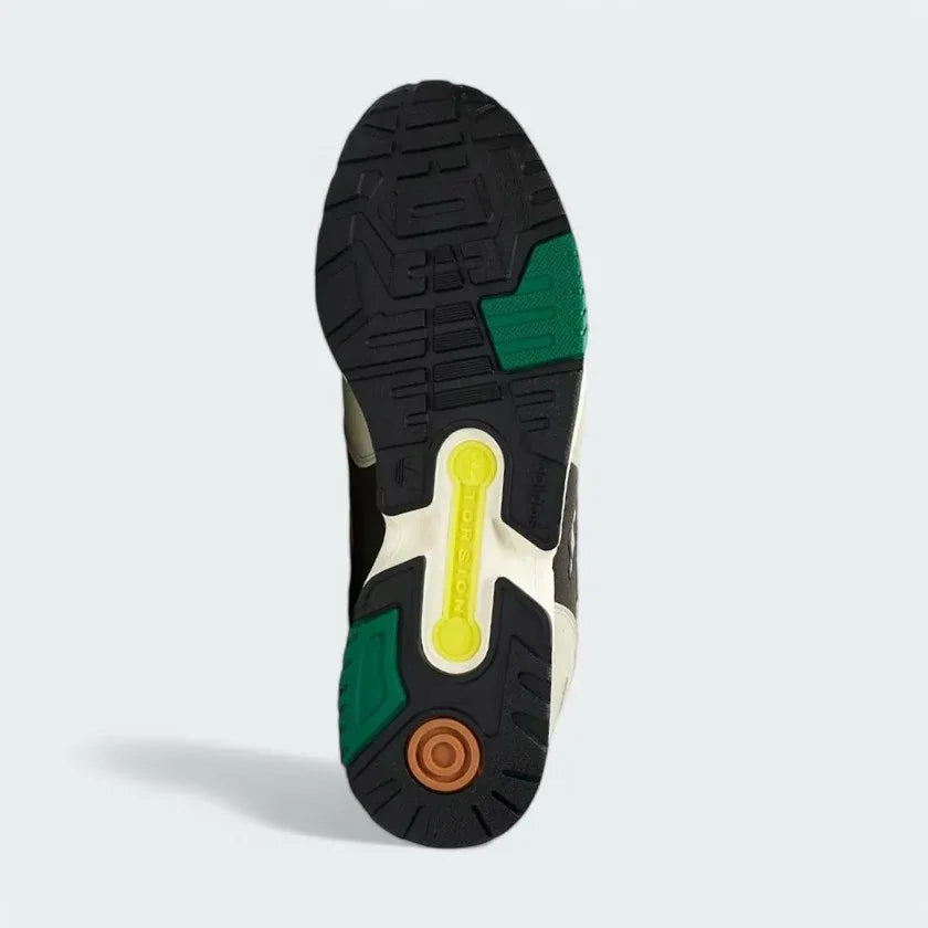 View of the outsole of the Adidas ZX 4000 Men's grey trainers, showing the durable rubber tread pattern with the Torsion System bridge.