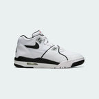 Nike Air Flight 89 Juniors' basketball trainers in white with black and red accents, side profile showing leather upper, visible Air unit in the heel, and Nike Swoosh.