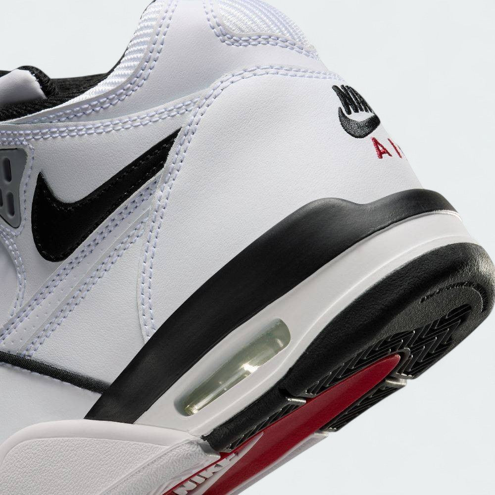 Detailed zoom on the outsole and midsole of the Nike Air Flight 89 Juniors' white basketball trainers, highlighting the visible Air cushioning and durable rubber outsole.