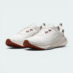 Emphasising the robust, trail-runner hybrid silhouette and the professional distribution of the pale ivory technical panels.