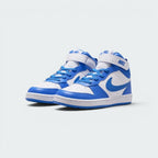 Emphasising the low-cut mid-top stance of the junior shoes and the clean color harmony between the white leather chassis and vivid Blue Crystal accenting.