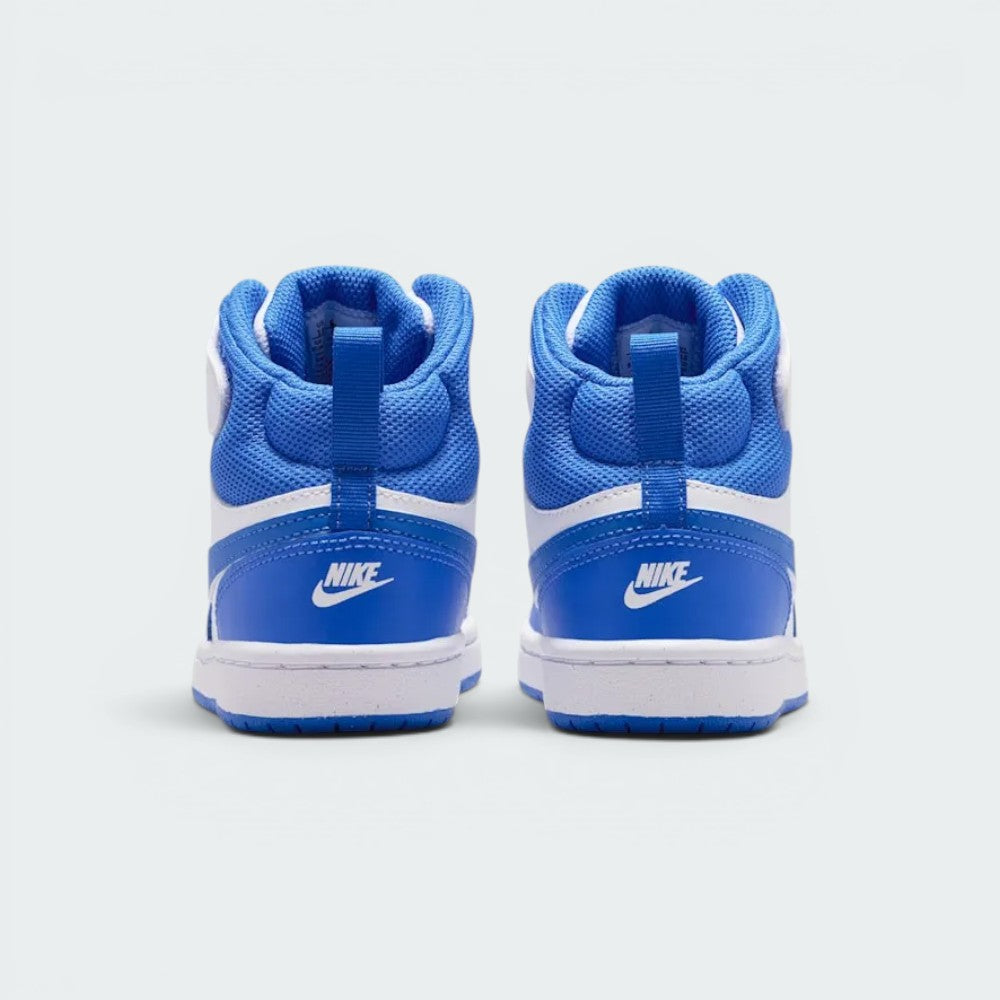 Focuses on the rear profile, highlighting the Blue Crystal leather heel cups with white embroidered "NIKE" logos, blue pull loops, and heavily padded blue mesh ankle collars.
