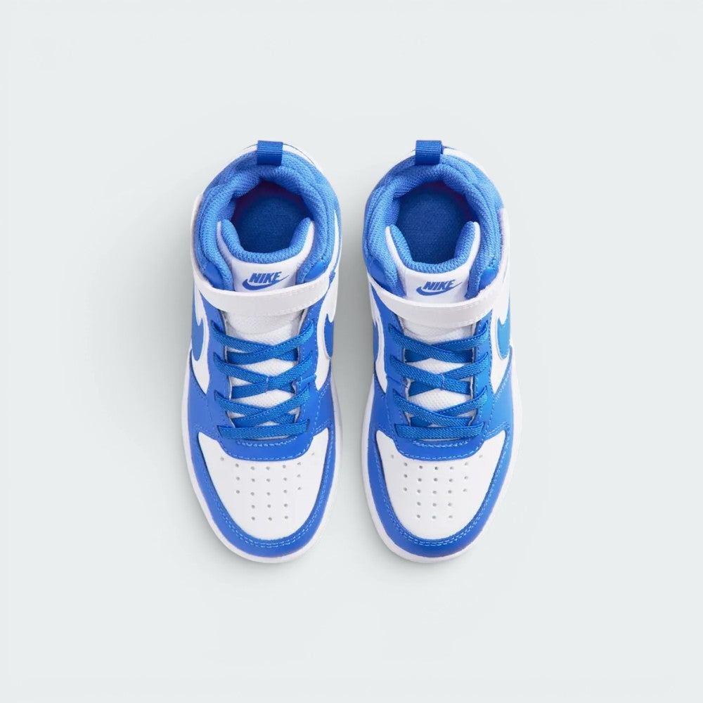 Focuses on the locked-in closure layout, displaying the symmetry of the white mesh tongue, Blue Crystal elastic laces, white leather strap with blue "NIKE" branding, and perforated toe box.