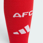 Details the high-definition woven "AFC" lettering and the precision of the contrast stitching.