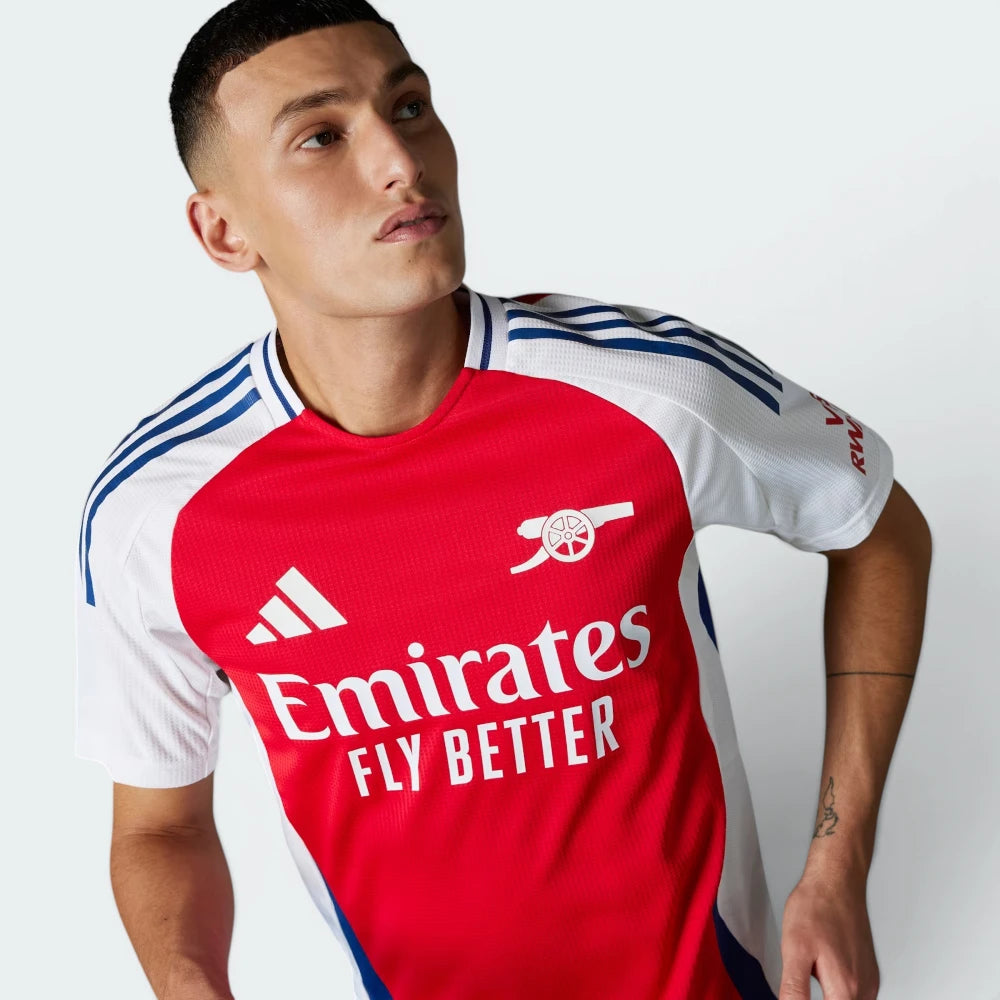 Details the pristine, high-definition execution of the heat-applied adidas logo and the iconic cannon crest.
