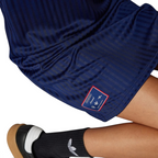 Displays the technical knit pattern of the dull-shiny polyester weave engineered for an unreal premium feel against the skin.