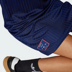 Displays the technical knit pattern of the dull-shiny polyester weave engineered for an unreal premium feel against the skin.