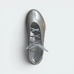 Focuses on the locked-in lace opening and the professional, minimalist presentation of the tongue-less upper.