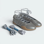 Pair of silver shoes with laces and a white background