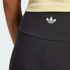 Close-up view of the back of the waistband, showing the fine-knit black fabric, neat flatlock stitching, and the printed white adidas Trefoil logo centered on the rear.