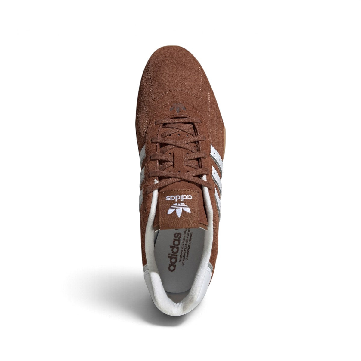 Overhead top-down view looking down at the laced brown driving shoes, displaying the matching brown flat laces, branded tongue tag with Trefoil logo, and narrow collar opening.