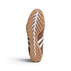 Bottom-down view of the gum rubber outsole, showcasing the organic ridged traction pattern and signature driving heel wrap.