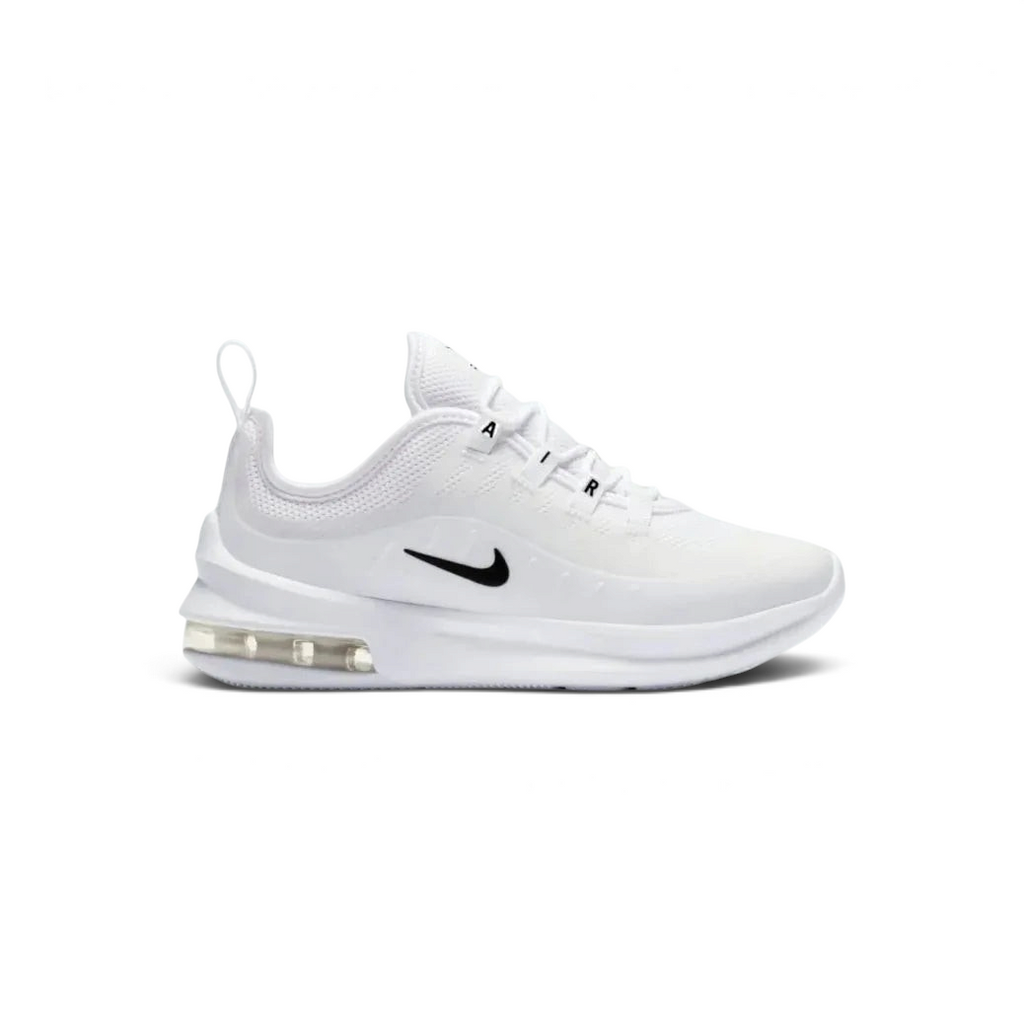 Nike Air Max Axis Children's trainers in white with black accents, side profile showing layered mesh and synthetic upper, prominent visible Max Air unit in the heel, and Nike Swoosh.