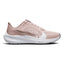 Displays the full lateral silhouette featuring the soft Pink Oxford mesh upper, the striking layered metallic Swoosh design, the thick white React foam midsole with embedded Air Zoom branding, and the textured outsole edge.
