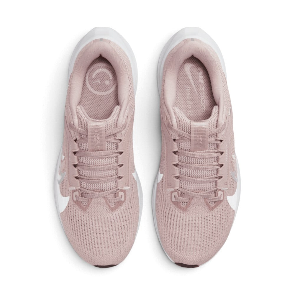 Direct overhead view of both shoes laid flat, showcasing the breathable forefoot mesh, flat pink laces threaded through supportive eyestay loops, custom graphic insoles, and cushioned collar openings.