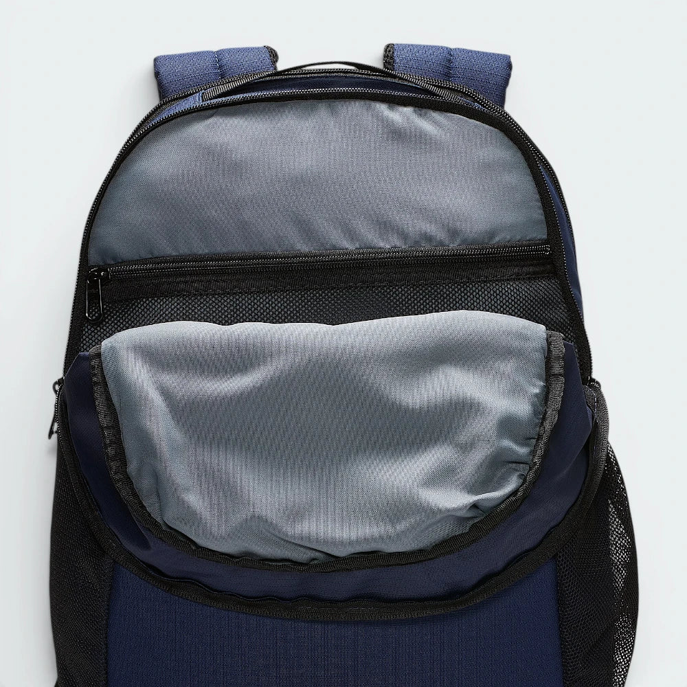 Focuses on the contoured shape of the back panel, highlighting the mesh padding lining the adjustable shoulder straps, engineered to cradle your back with elite comfort.