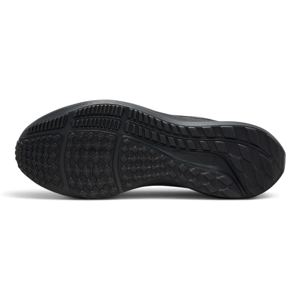 Full-length bottom profile showing the black carbon rubber outsole, highlighting the Waffle-inspired rectangular traction lugs, segmented lateral crash rail, forefoot flex grooves, and debossed Nike Swoosh.