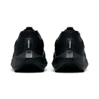 lose-up rear angle focusing on the beveled React foam heel crash pads, vertical high-visibility reflective strips on the heel counters, and plush padded black collar lining.