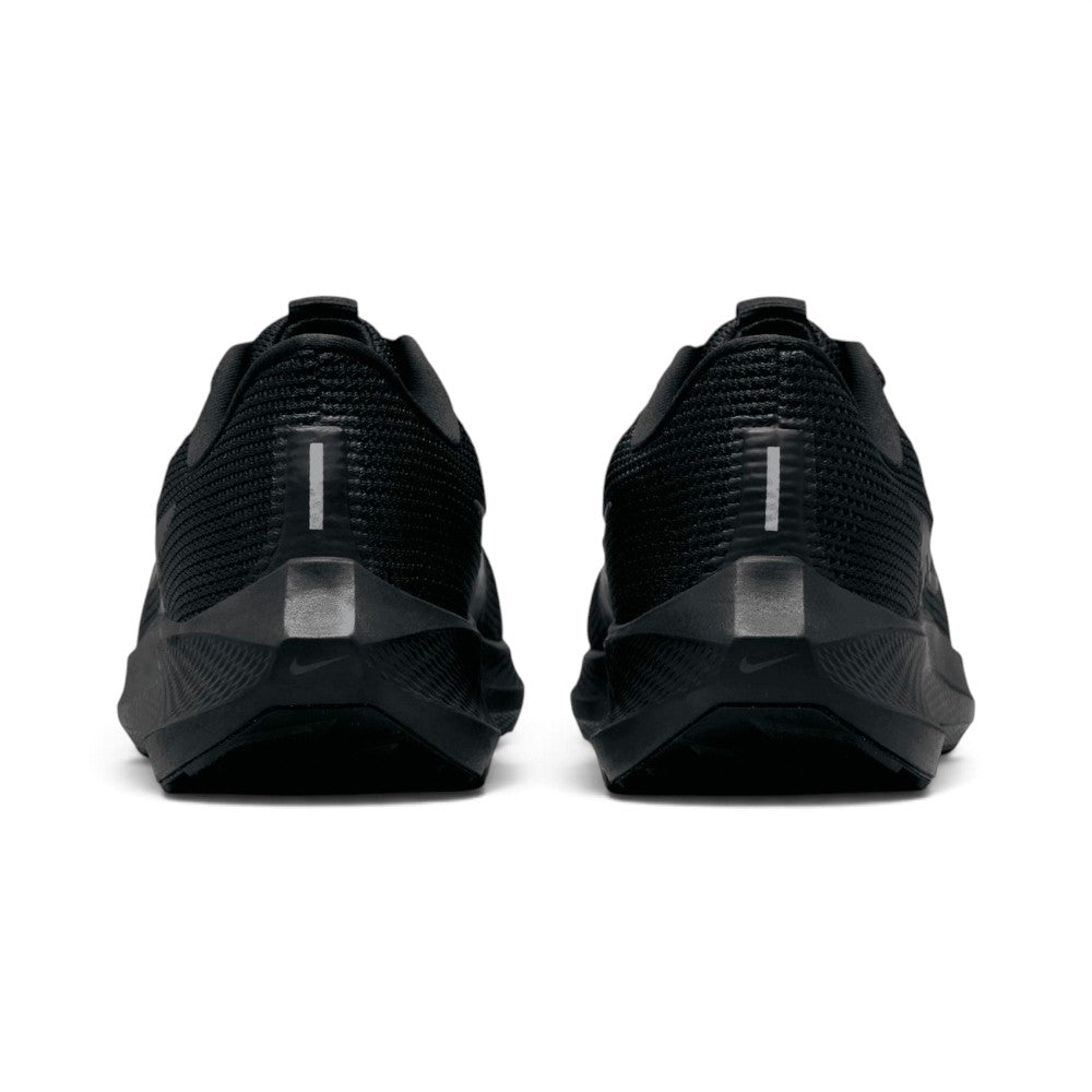 lose-up rear angle focusing on the beveled React foam heel crash pads, vertical high-visibility reflective strips on the heel counters, and plush padded black collar lining.