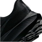 Angled macro view focusing on the textured diamond patterning on the black Nike React midsole wall, lateral outsole crash rail lugs, and heel bevel geometry.