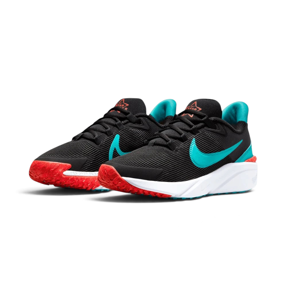 Emphasising the low-cut, athletic running stance of the youth shoes, highlighting the sport harmony of the bright crimson and teal contrast accents.