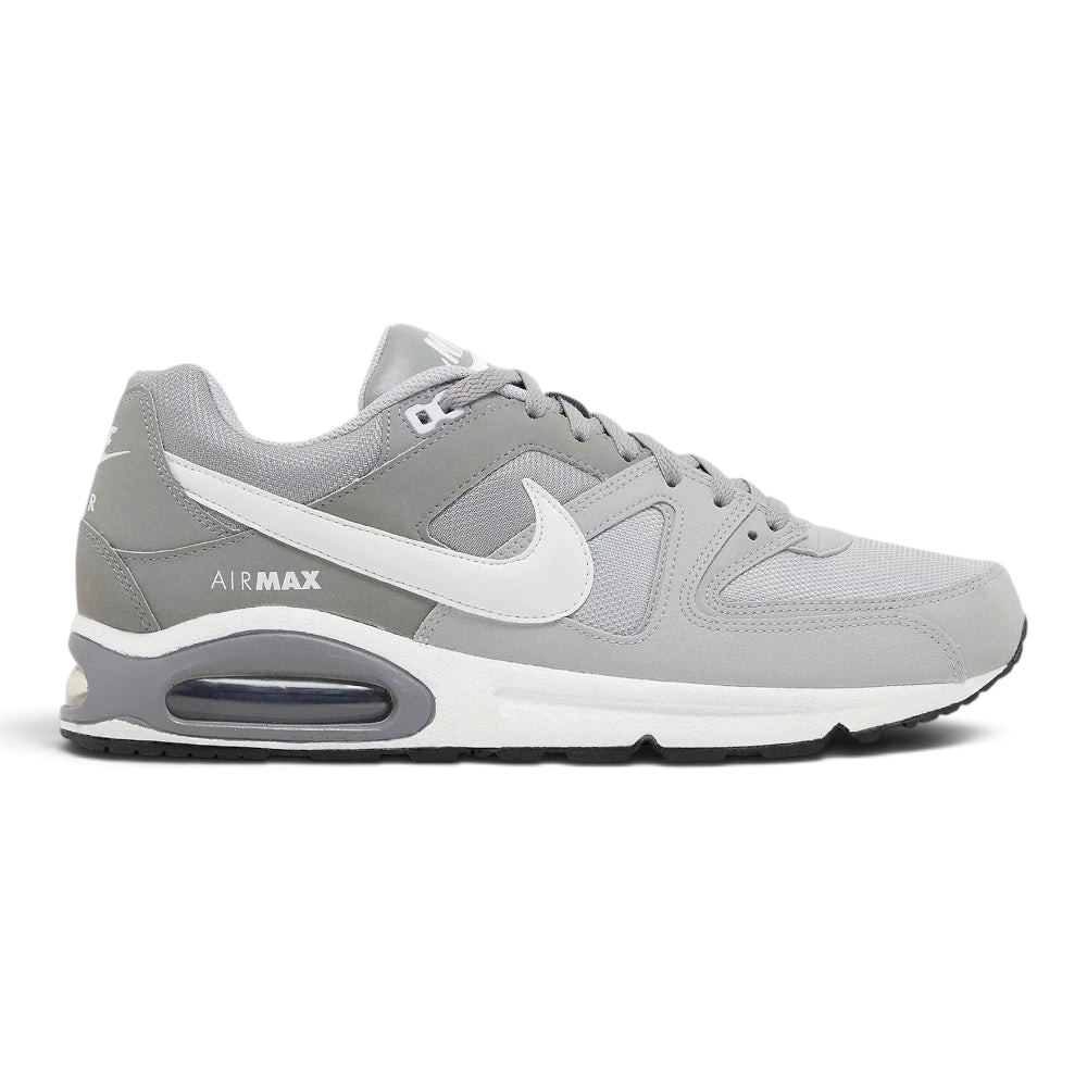 Highlights the high-velocity sweep of the contrasting white Nike Swoosh, showing the professional, multi-textured grey mesh underlays, the clean Stealth grey overlays, and the prominent visible Max Air window embedded in the heel of the foam midsole.