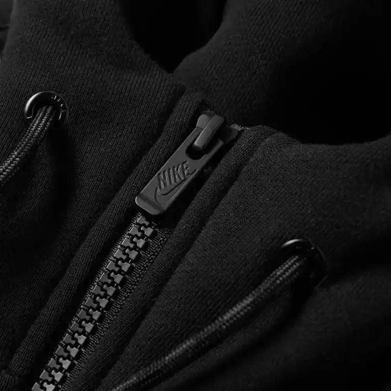 Trade Sports Nike Air black and anthracite fleece hoodie featuring a detailed view of the branded half-zip placket