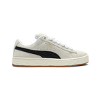 Displays the lateral view showing the Sand beige suede upper, prominent Black smooth leather Formstrip, gilded metallic "PUMA SUEDE XL" branding, chunky off-white textured midsole with gum outsole base, and oversized white fat laces.