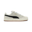 Displays the lateral view showing the Sand beige suede upper, prominent Black smooth leather Formstrip, gilded metallic "PUMA SUEDE XL" branding, chunky off-white textured midsole with gum outsole base, and oversized white fat laces.