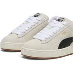 Details the micro-precision of the forefoot area from an elevated angle, showing the soft Sand suede toe boxes, chunky woven white fat laces, and padded tongue crests.