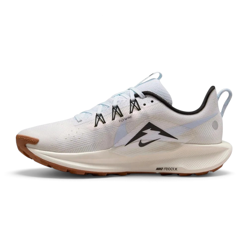 Trade Sports Nike Women's ReactX Pegasus Trail 5 in white and blue with a brown all-terrain rubber outsole.