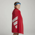 child using the towel to dry up after swimming