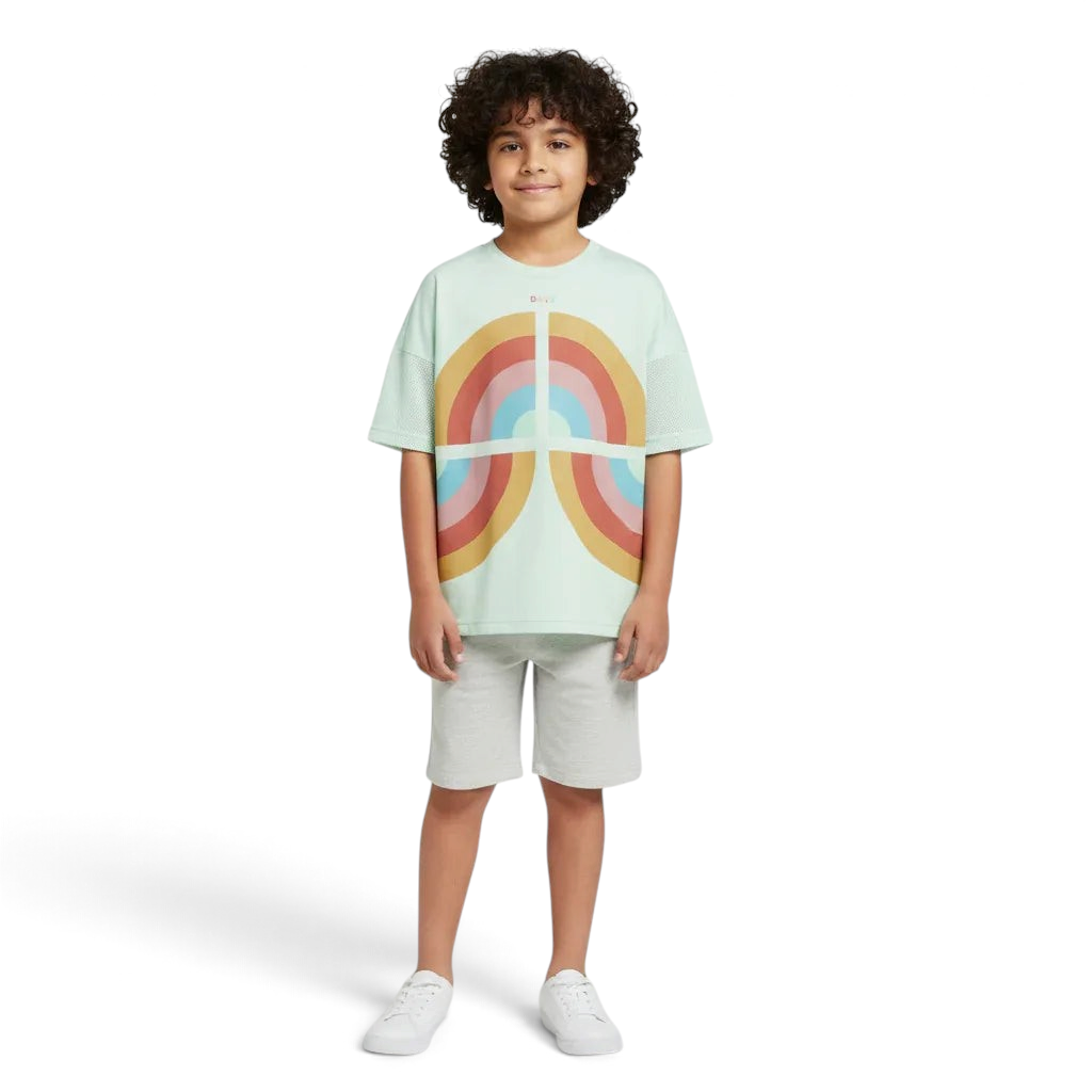 Child wearing a light green t-shirt with a rainbow design on a white background Main image