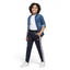 Highlights the tapered leg silhouette and the iconic side branding.