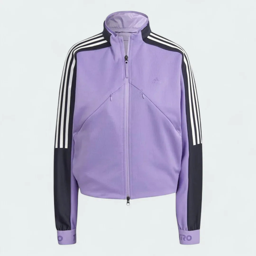 Adidas Tiro Track Top Women's in purple, front view showing the full zip, stand-up collar, white 3-Stripes on sleeves, and Adidas logo on the chest.