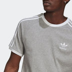 Close-up of Trefoil logo and crew neck







