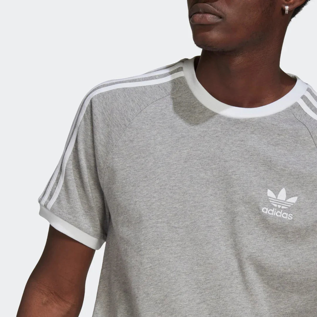 Close-up of Trefoil logo and crew neck







