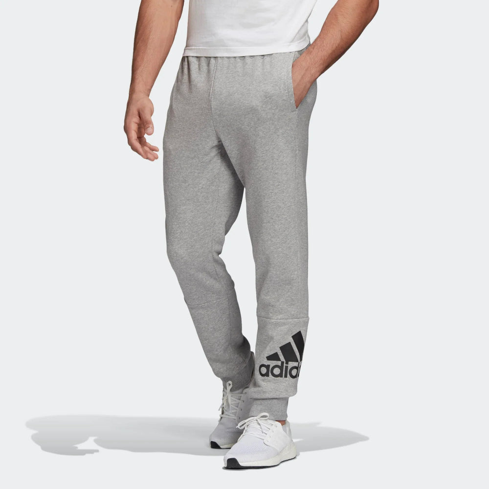 Highlights the tapered leg shape and the bold contrast Badge of Sport logo on the lower leg. Main image
