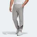 Highlights the tapered leg shape and the bold contrast Badge of Sport logo on the lower leg.